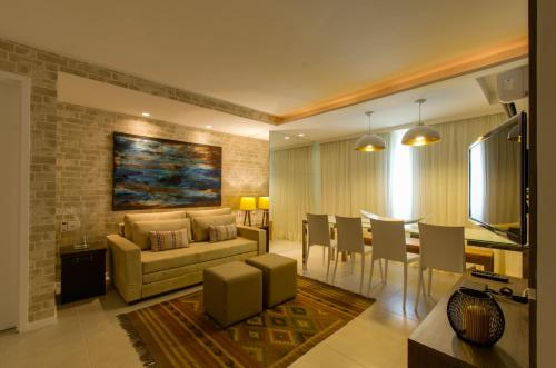 
a living room filled with furniture and a fireplace at Dream Home Maceio in Maceió
