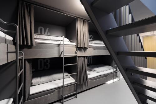 a group of bunk beds in a room at BOOK1 by Brøchner Hotels in Aarhus