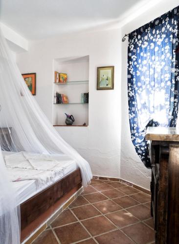 Postel nebo postele na pokoji v ubytování Şato Triopia Butik Otel