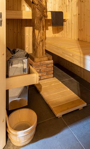 a sauna with a tree in the middle of it at Vakantiehuis An Diek in Staphorst