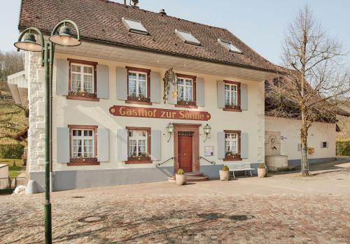 a building with a sign on the front of it at Landgasthof zur Sonne in Wehr