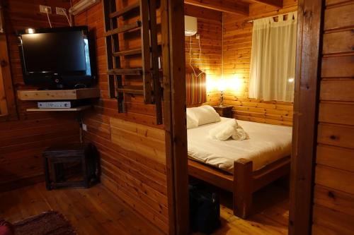 Lova arba lovos apgyvendinimo įstaigoje Cabin Resort