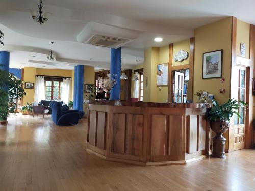 
a large room with a wooden floor and a large window at Antiguas Eras La Alberca in La Alberca
