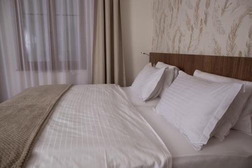 Postel nebo postele na pokoji v ubytování Hotel Prichovice