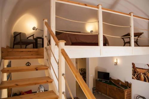 a bunk bed in a room with a staircase at Naturalmente abitare in Catania