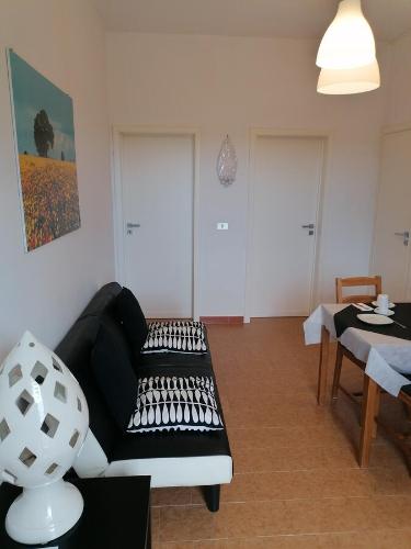 a living room with a couch and a table at B&B Brunone in Alberobello