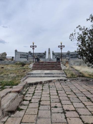 a group of crosses on top of a building at Noosh guesthouse in Ashnak
