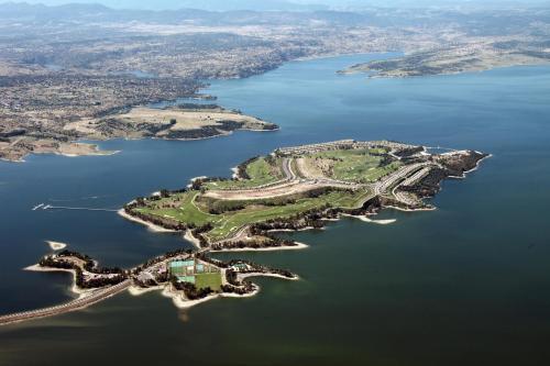 an aerial view of a group of islands in the water at Vincci Valdecañas Golf in El Gordo