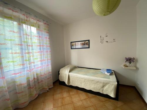 מיטה או מיטות בחדר ב-Casa Degli Eroi
