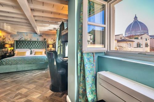 a bedroom with a bed and a window at Arte' Boutique Hotel in Florence
