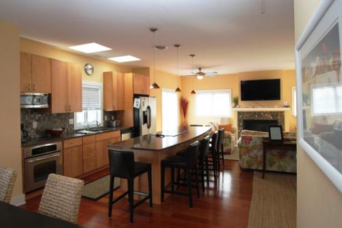 a kitchen with a table and some chairs in it at 96 Mays Way, SOUTH Bethany Beach in Bethany Beach