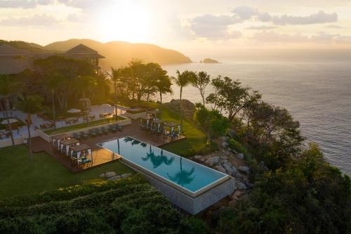 a view from a balcony overlooking the ocean at Banyan Tree Cabo Marques in Acapulco