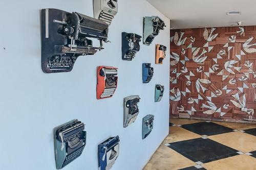 a refrigerator with stickers on the side of it at Mirante do Arvrao in Rio de Janeiro
