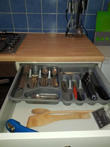 a kitchen sink filled with lots of utensils at Millhill St Dunfermline in Dunfermline