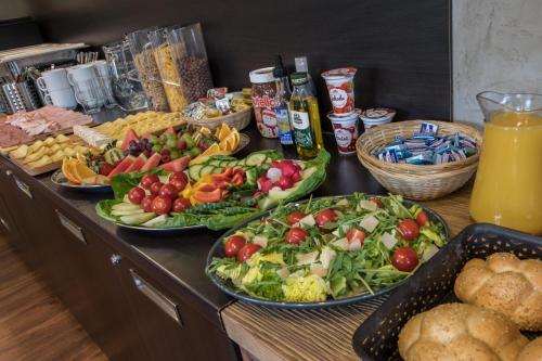 a buffet with many plates of food on a table at Apartmány 294 in Bedřichov