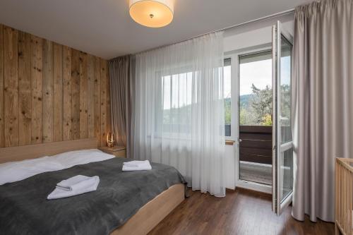 Postel nebo postele na pokoji v ubytování Apartmány 294