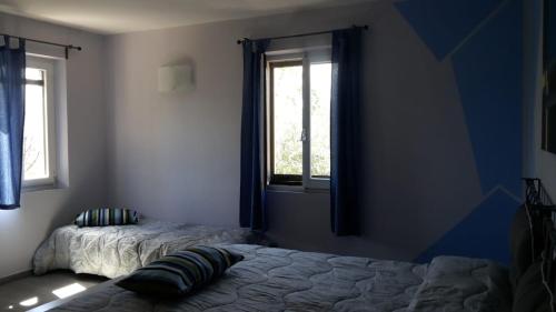 Postel nebo postele na pokoji v ubytování Sotto l'Ulivo