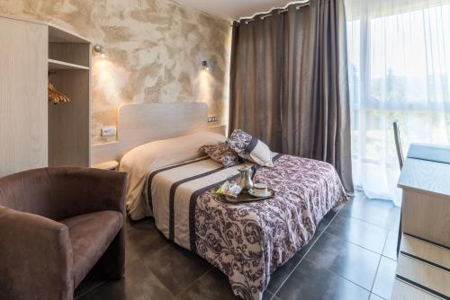 Postel nebo postele na pokoji v ubytování Hôtel Morris
