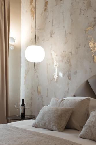 Letto o letti in una camera di Castellano Hotel & Suites