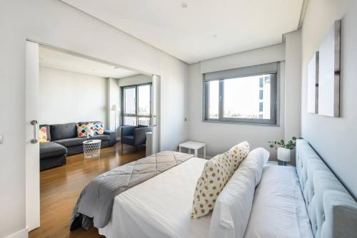 Katil atau katil-katil dalam bilik di JA Suites Madrid