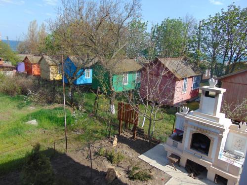 an aerial view of a group of colorful houses at Вапнярка, Одесская область, жилье у моря in Vapnyarka