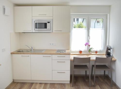 Kuchyň nebo kuchyňský kout v ubytování Boardinghouse Jungwirth-Wohnzeit