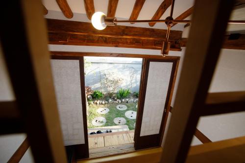 an overhead view of a garden seen through a window at GaEunChae in Jeonju