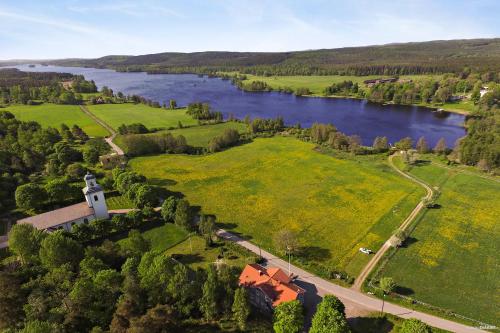 an aerial view of a field and a river at Asa Vandrarhem in Lammhult