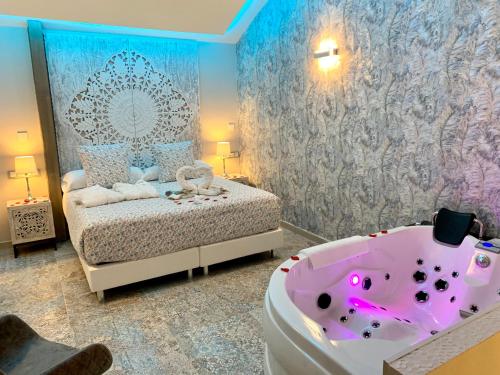 Akla Hotel Méridaにあるベッド