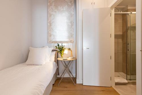 Postel nebo postele na pokoji v ubytování Plaza de España Deluxe Suites