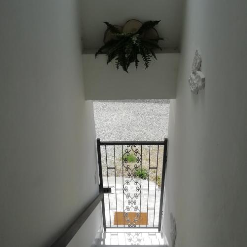 an overhead view of a stairway with a gate at Casa Maria in Cantù