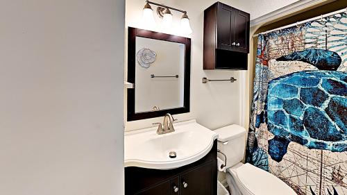a bathroom with a sink and a shower at Beach Vacation Condos in Myrtle Beach
