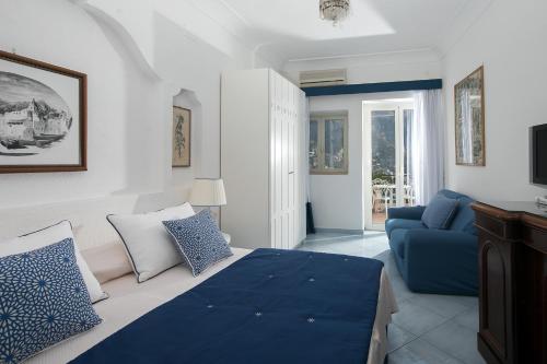 Ένα ή περισσότερα κρεβάτια σε δωμάτιο στο Luxury Villas Positano