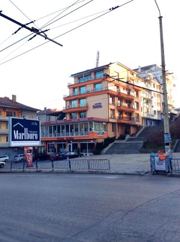 a building on the side of a city street at Hotel Elena in Veliko Tŭrnovo