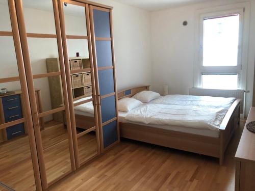 Posteľ alebo postele v izbe v ubytovaní Bright apartment with a free parking garage @ Wienerberg