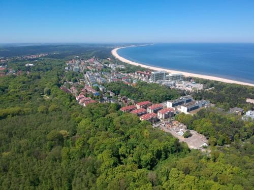 an aerial view of a city and a beach at Apartamenty Świnoujście - Baltic Park Promenada in Świnoujście