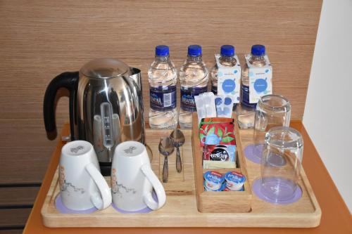 a tray with bottles of water and drinks on a table at Novotel Vijayawada Varun in Vijayawāda
