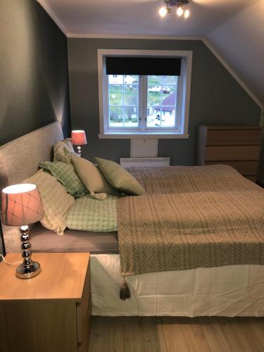 A bed or beds in a room at Stryn - house by the river