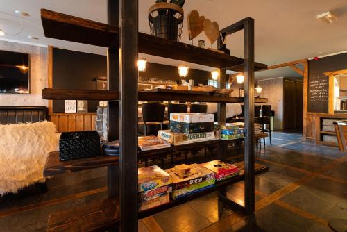 a room with a shelf with food on it at Hotel Buxus in Gasselte