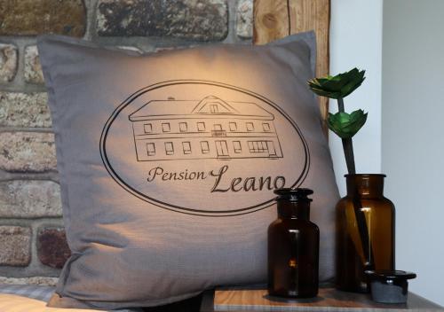 a pillow with the pinson team on it at Pension Leano in Nötsch