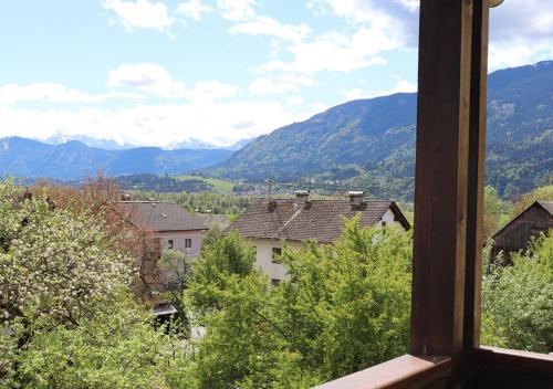 a view from a window of a town with mountains at Pension Leano in Nötsch
