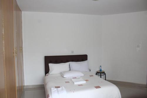 Ein Bett oder Betten in einem Zimmer der Unterkunft Salient Guest House