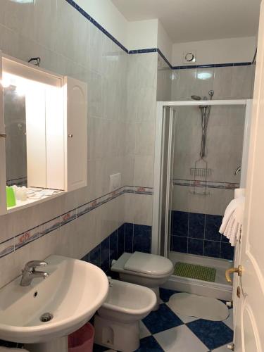 a bathroom with a sink and a toilet and a shower at Hotel Residence Villa Jolanda in Lido di Camaiore