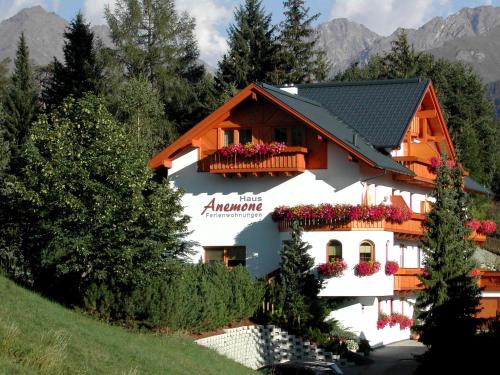 a building with flowers on the balconies of it at Haus Anemone in Serfaus