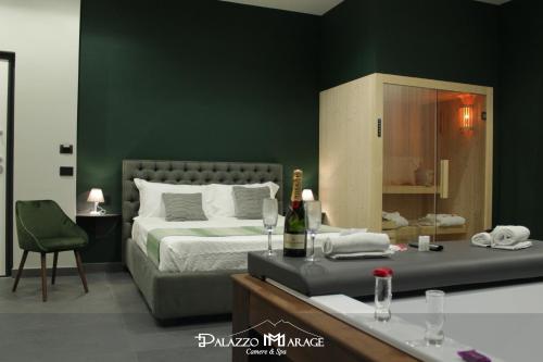 a bedroom with a bed and a green wall at Palazzo Marage in Torre del Greco