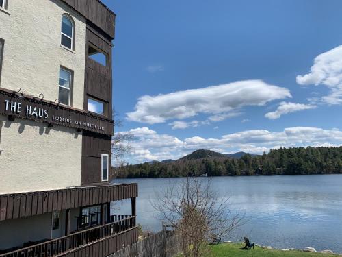 a building with a view of a lake at The Haus On Mirror Lake in Lake Placid
