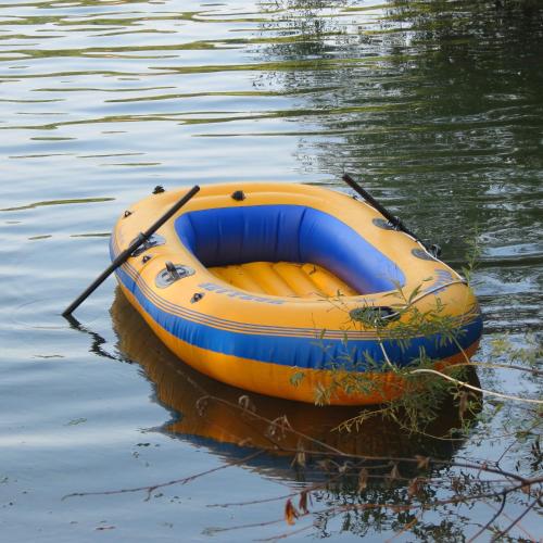 an orange and blue boat sitting in the water at RIVER KOLPA APARTMENT, Griblje ob reki Kolpi in Gradac
