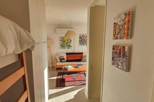 a view of a living room with a couch in a room at Departamento Orilla De Lago in Puerto Varas