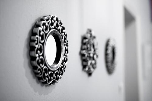 a black and white picture of a ring on a wall at Christi Iuxury Apartment in Preveza