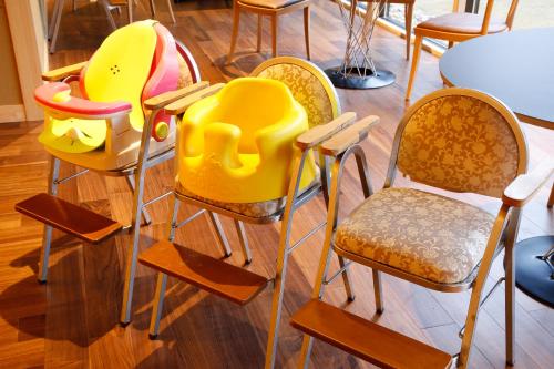 a group of chairs in a room with a table at The Shiroyama Terrace Tsuyama Villa in Tuyama
